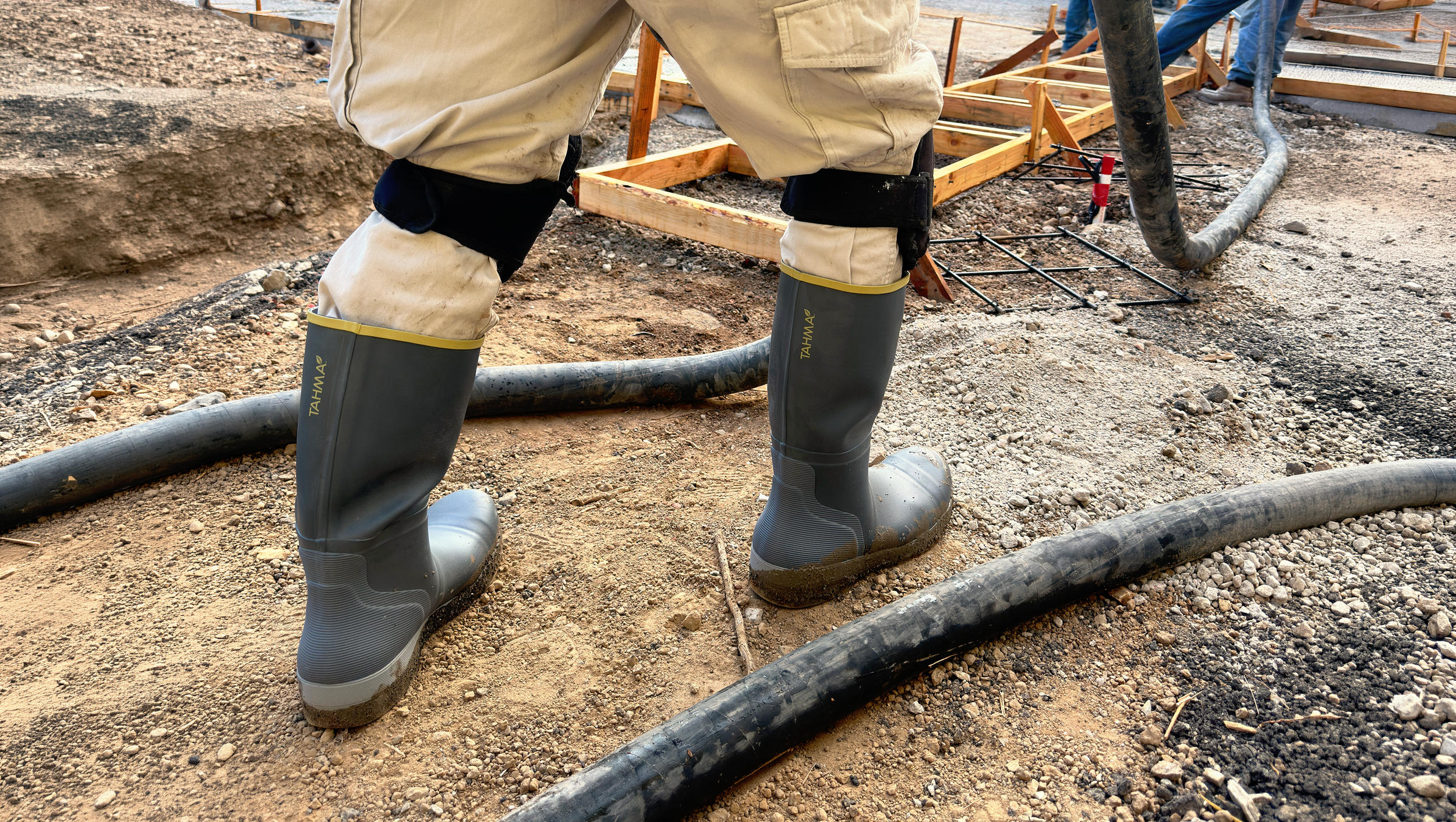 Tahma boots at a construction site pouring concrete
