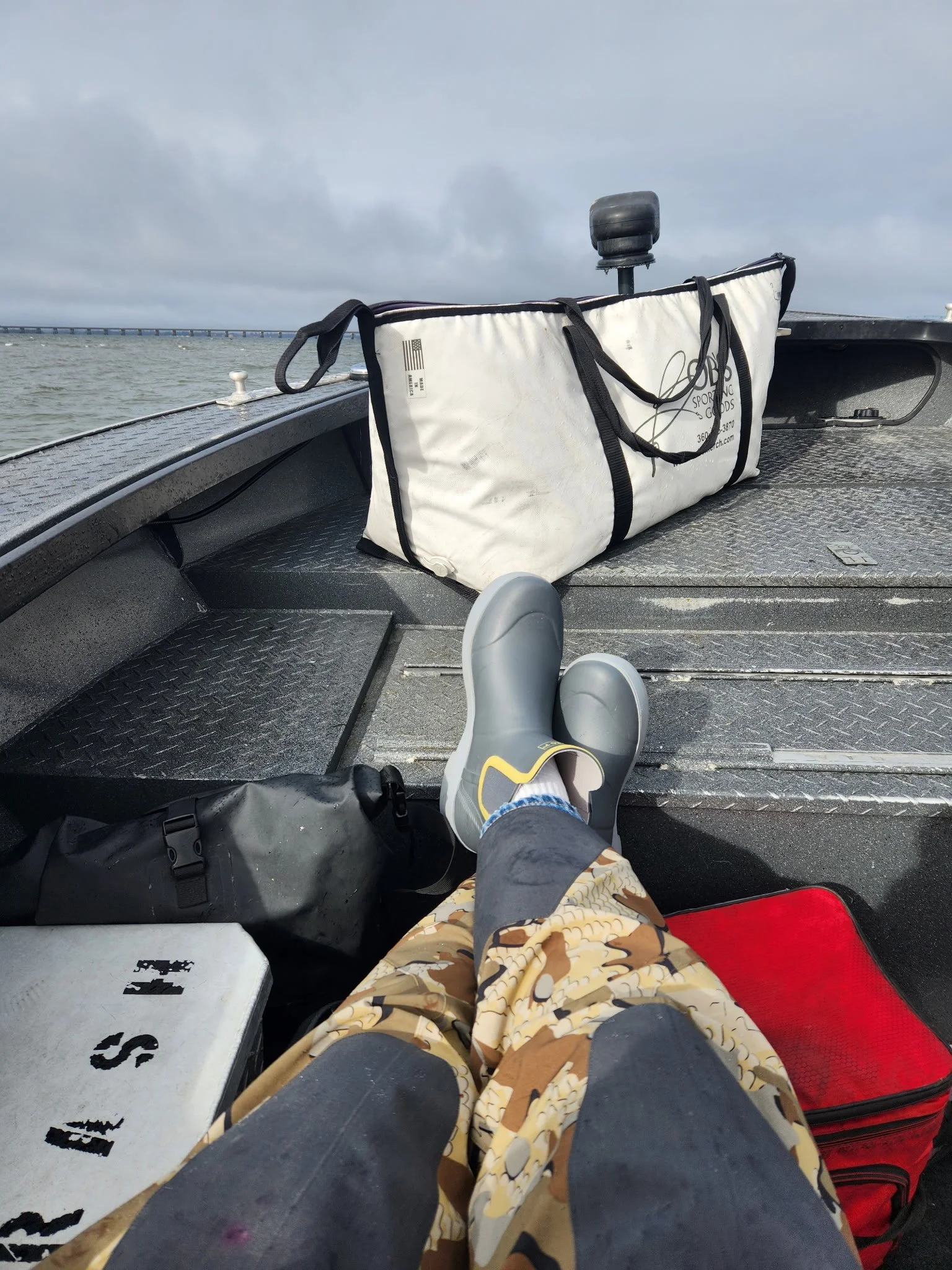 Customer waering low-cut Tahma boots on a small fishing boat