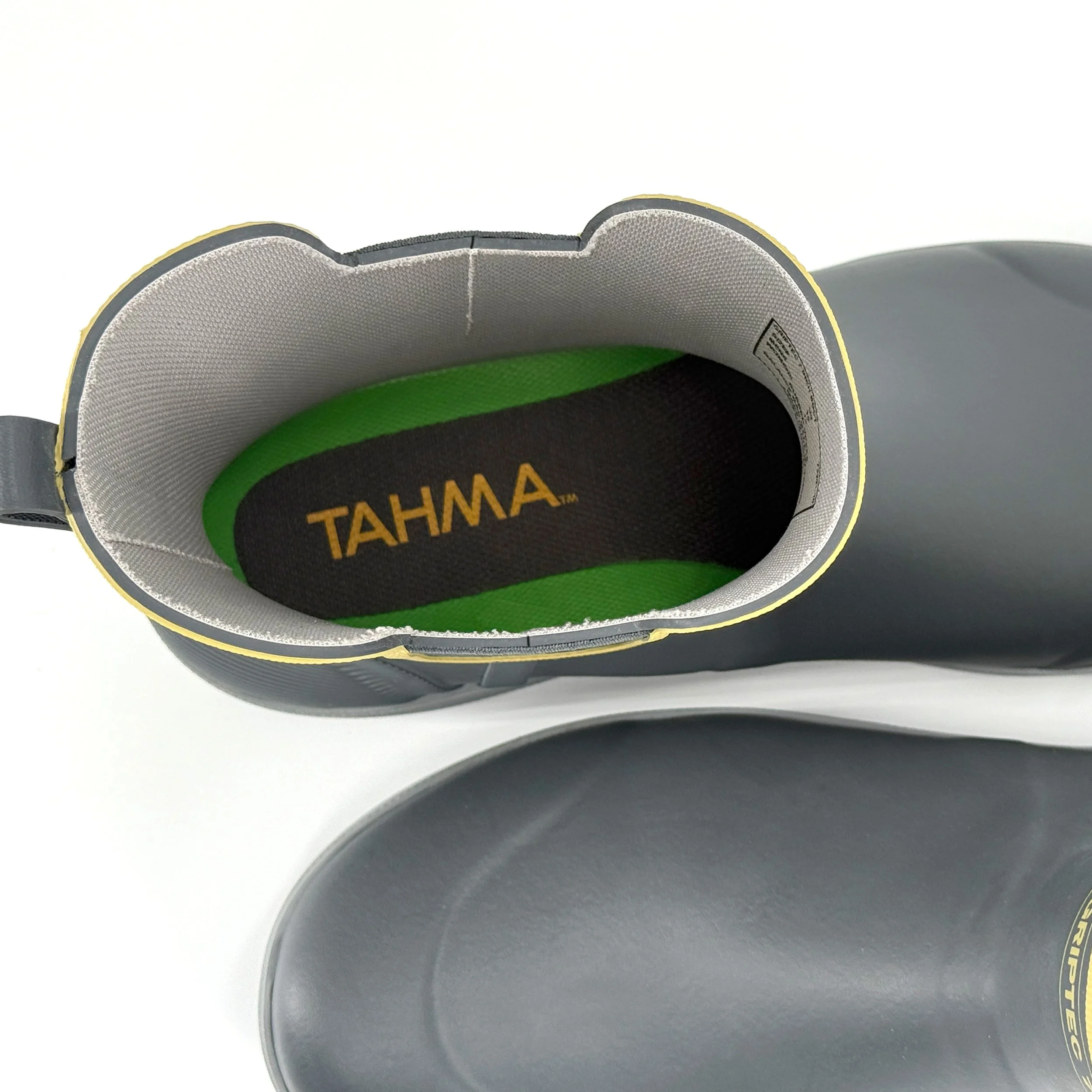 looking down into a tahma boot at the logo branding on the insole