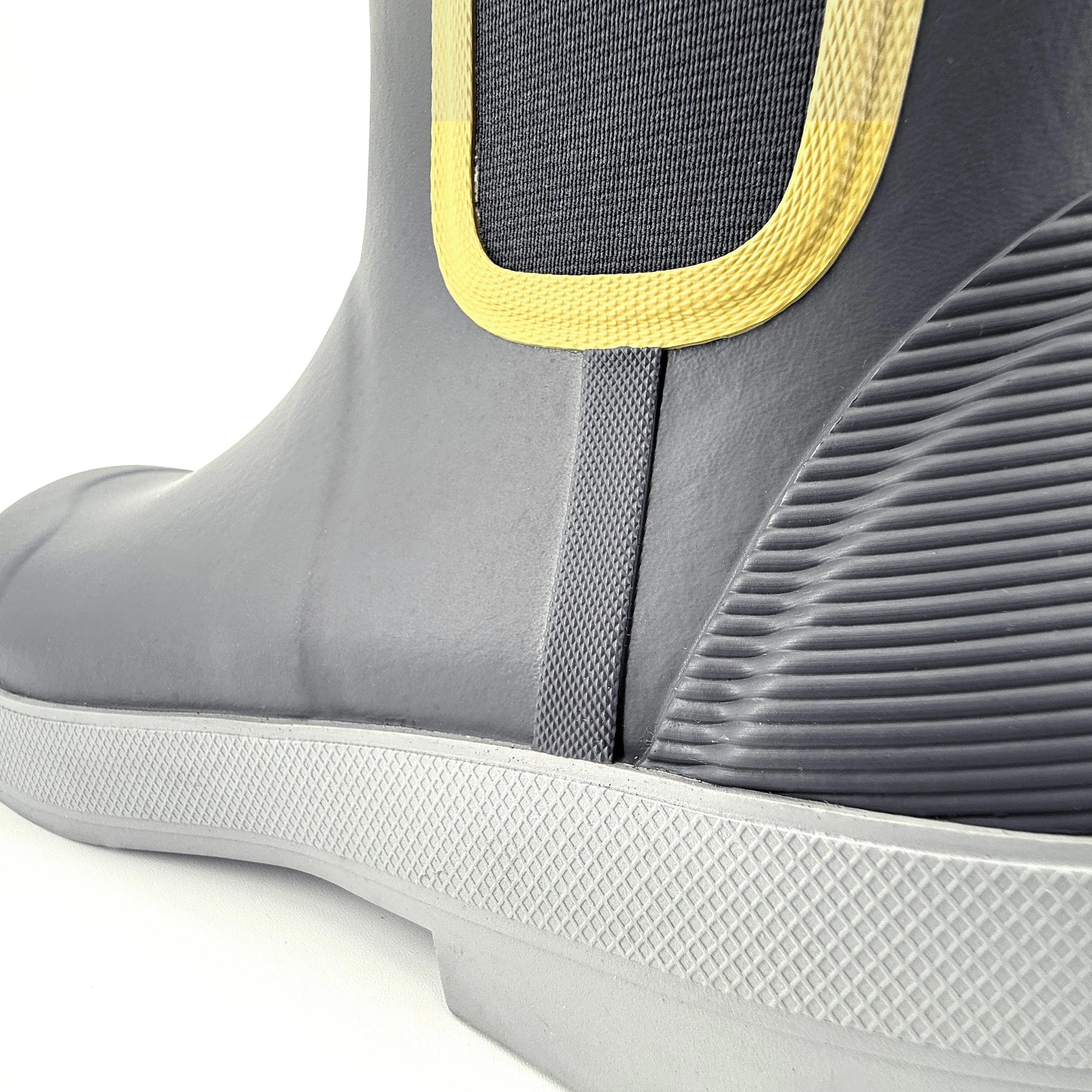 Tahma Low-Cut Boot side view closeup of sidewalls, texture and style on a white background