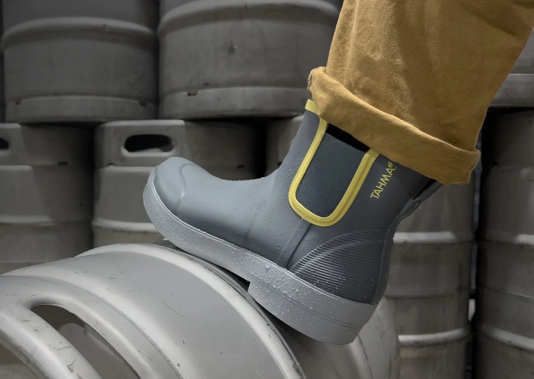 Tahma low-cut boot stepping on a keg at a brewery