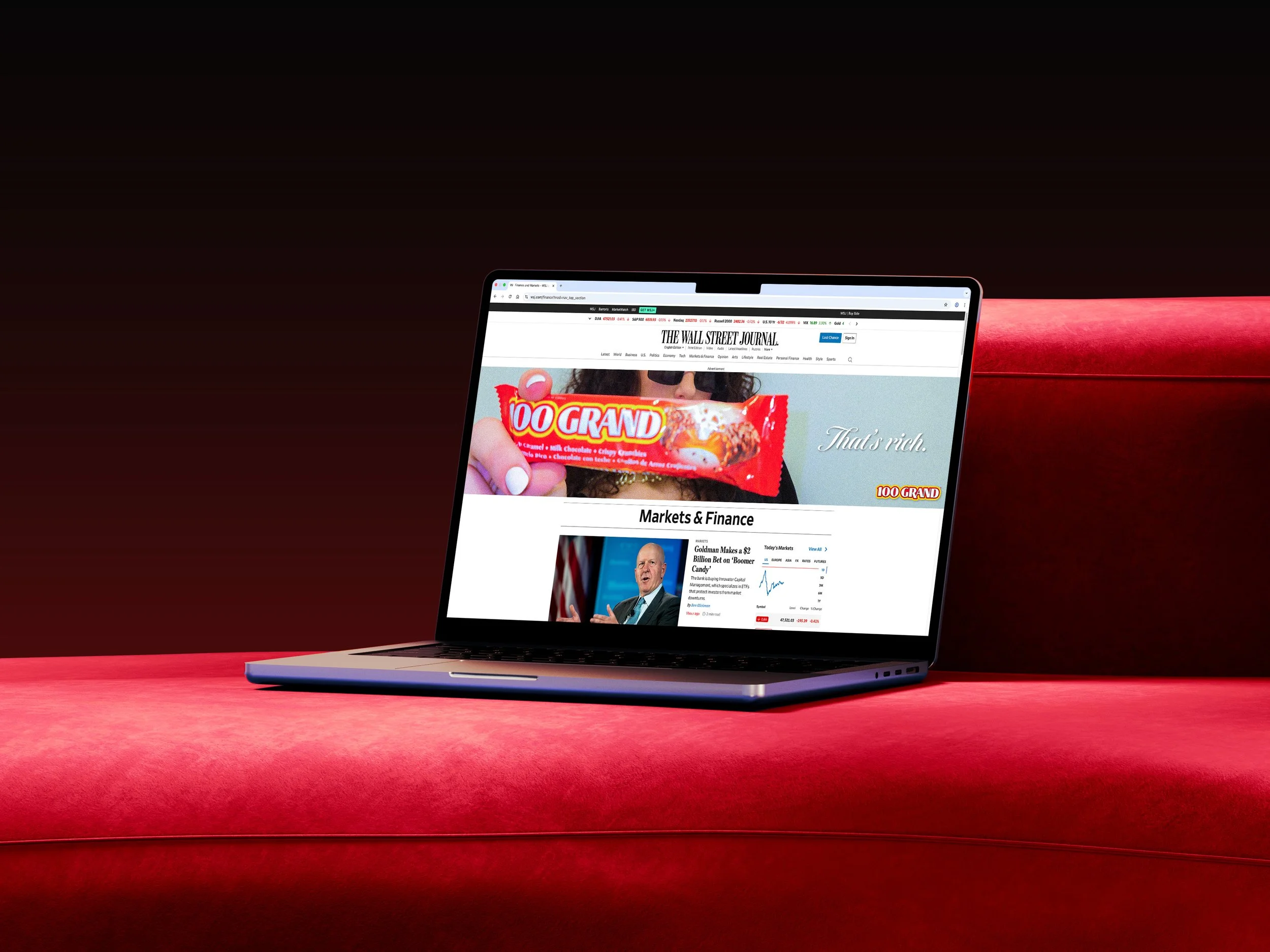 100 grand laptop on couch mockup.jpg