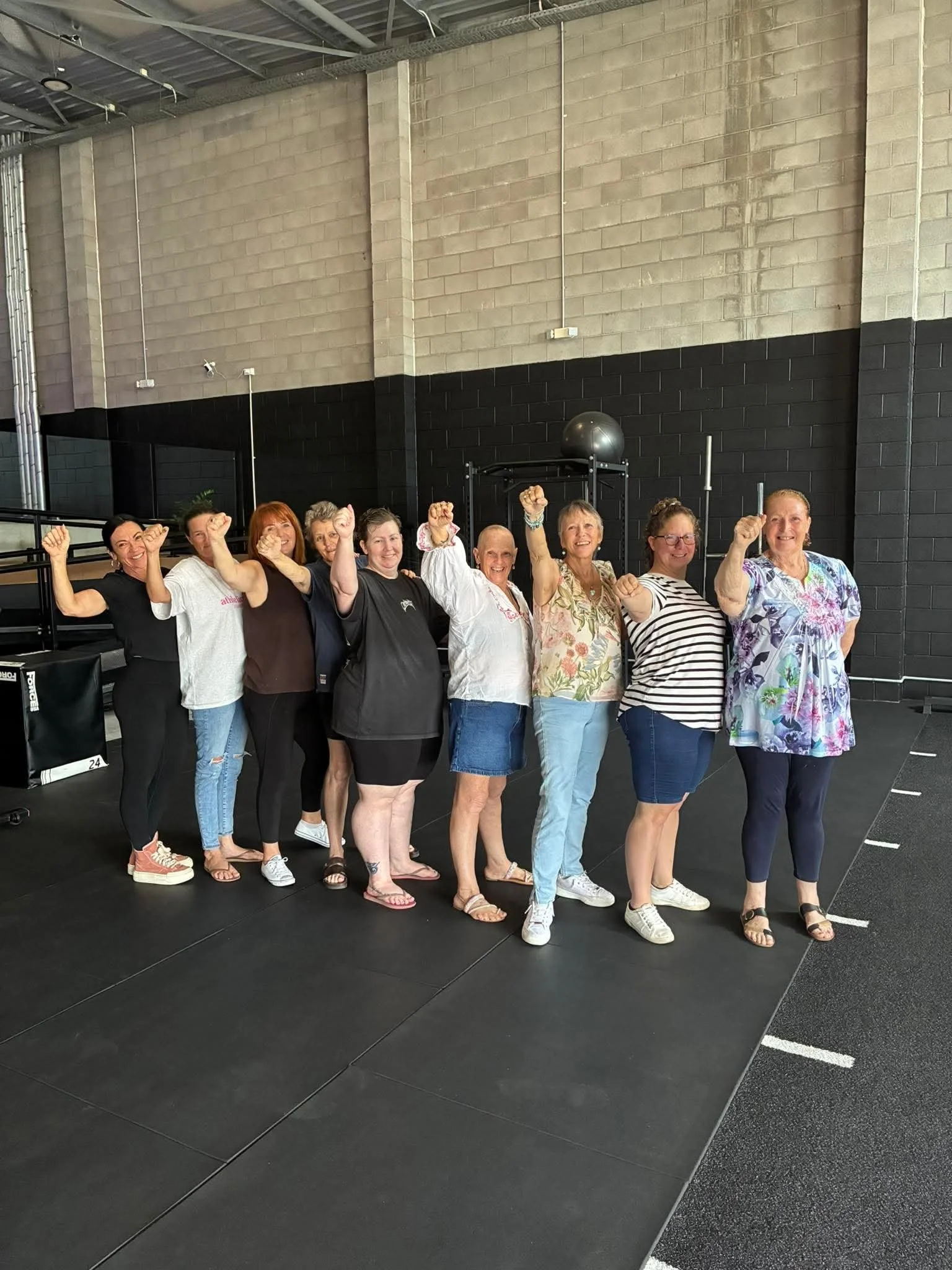 pinkco-group-two-attendees-posing-for photo.jpeg