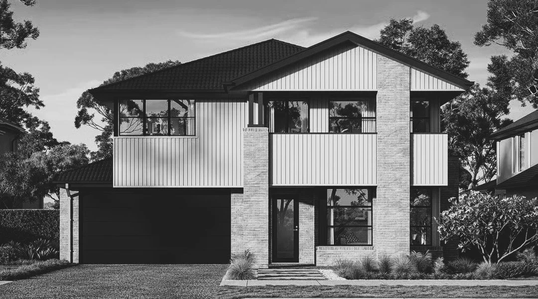 Black and white photo of a two-story modern house with a garage, large windows, a front door, and landscaped yard.