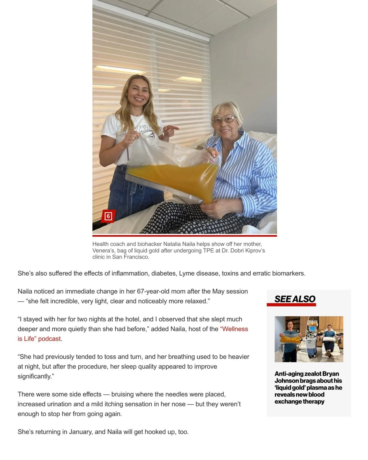 A young woman and an older woman in a hospital room holding a large, clear plastic bag filled with a yellow liquid. The older woman is sitting on a bed, and the younger woman is standing beside her, both smiling.