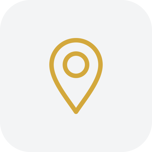 Icon of a location pin in gold color.