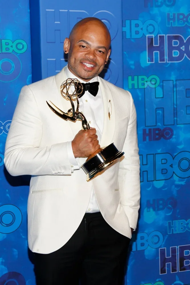 Picture of Anthony Hemingway with an Emmy Award at an HBO event. Hemingway will direct The Confessions of Al McGuire film