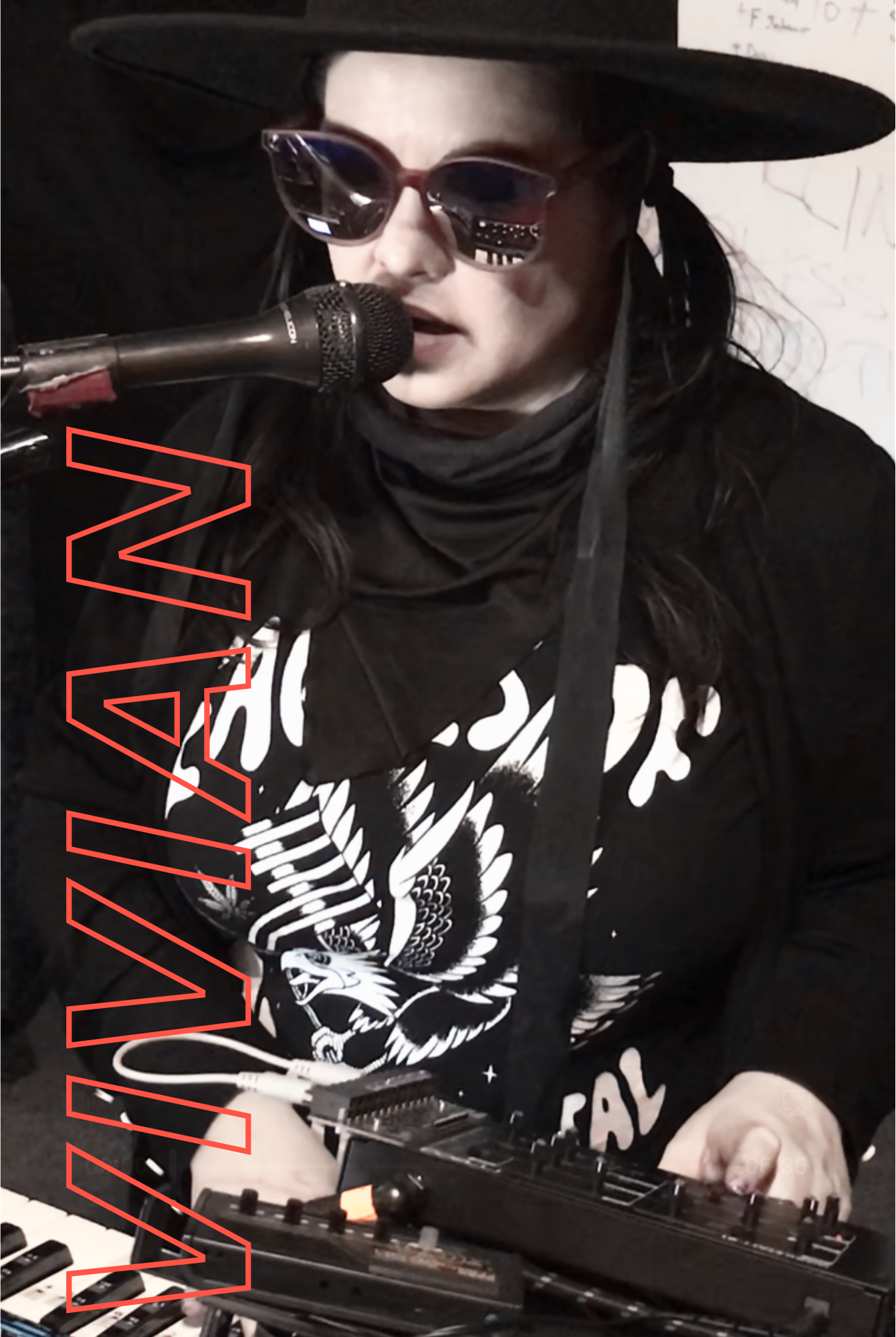 Vivian of The Stolen Moans recording vocals and playing keyboards in the studio