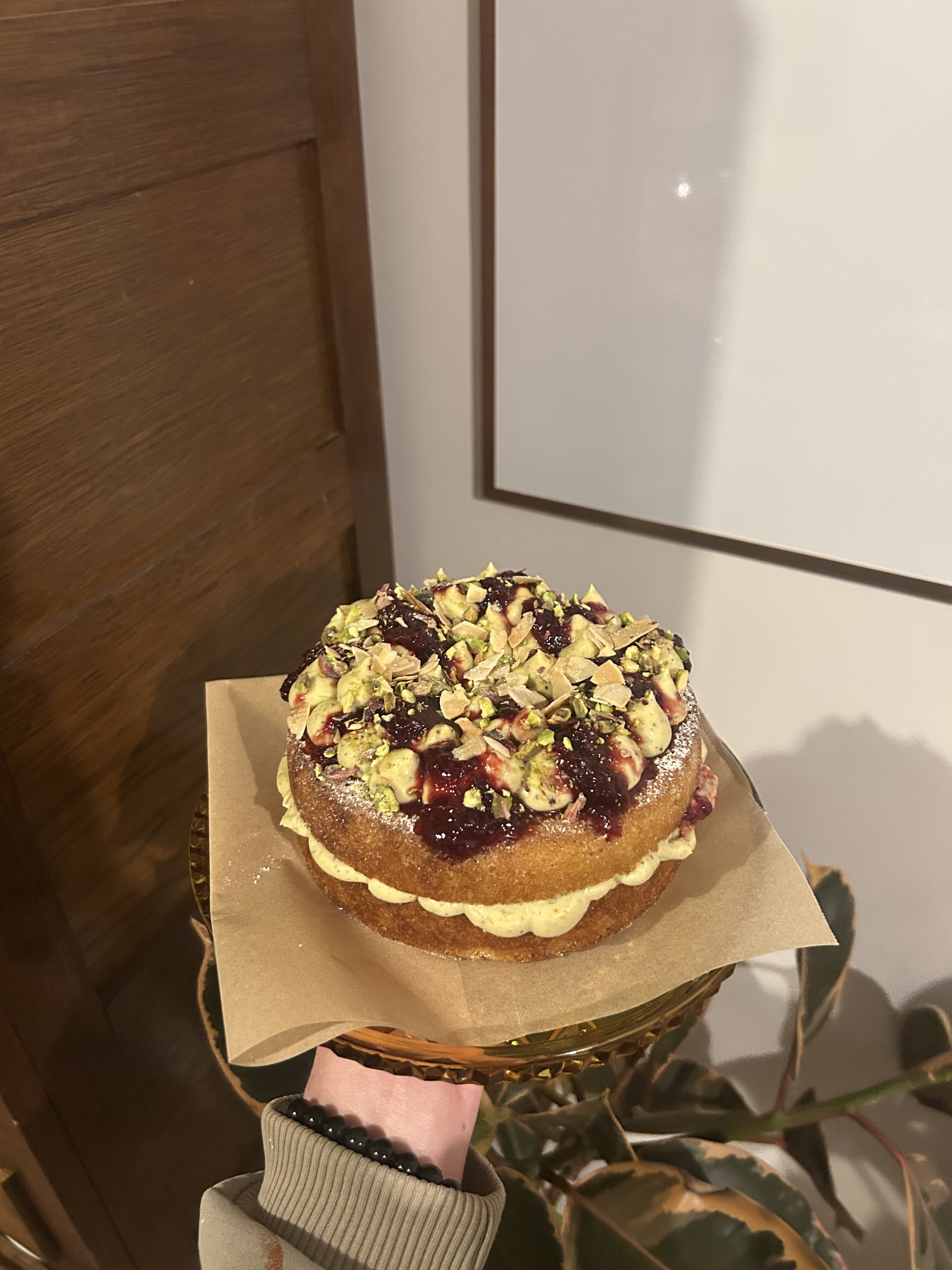 almond butter cake w pistachio creme + sour cherry jam