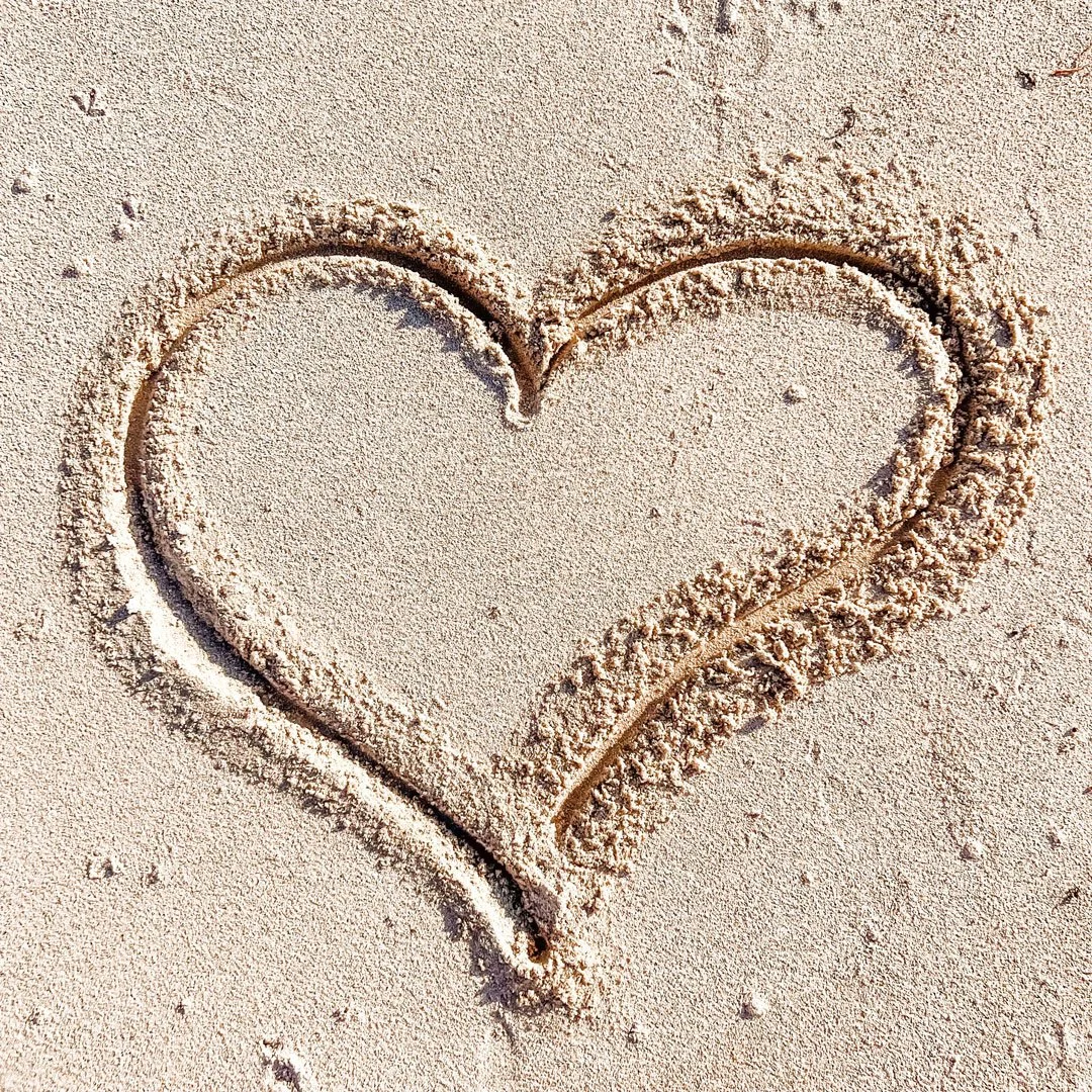 Emotional prompts. Heart in sand.
