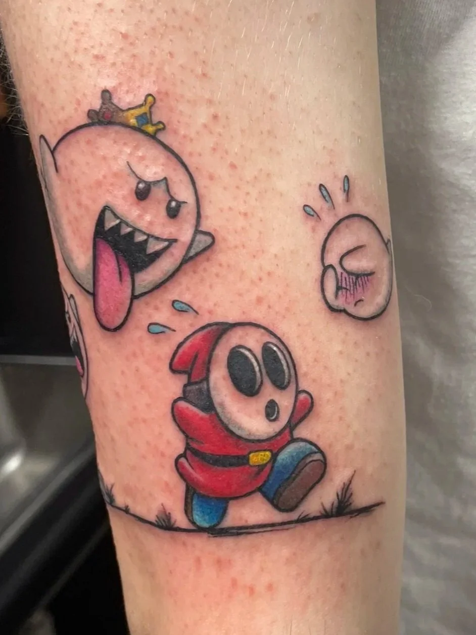 Tattoo of three characters from the Mario video game franchise, all in a cute, cartoon style, tattooed by Zing Phelps, in Cedar Rapids, Iowa