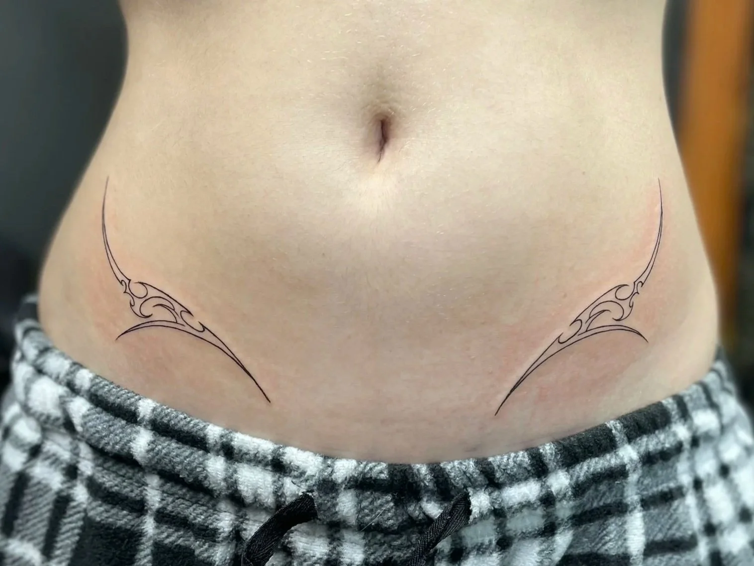 tattooed dainty cybersigilism on a torso, fine line, tattooed by Zing Phelps, in Cedar Rapids, Iowa