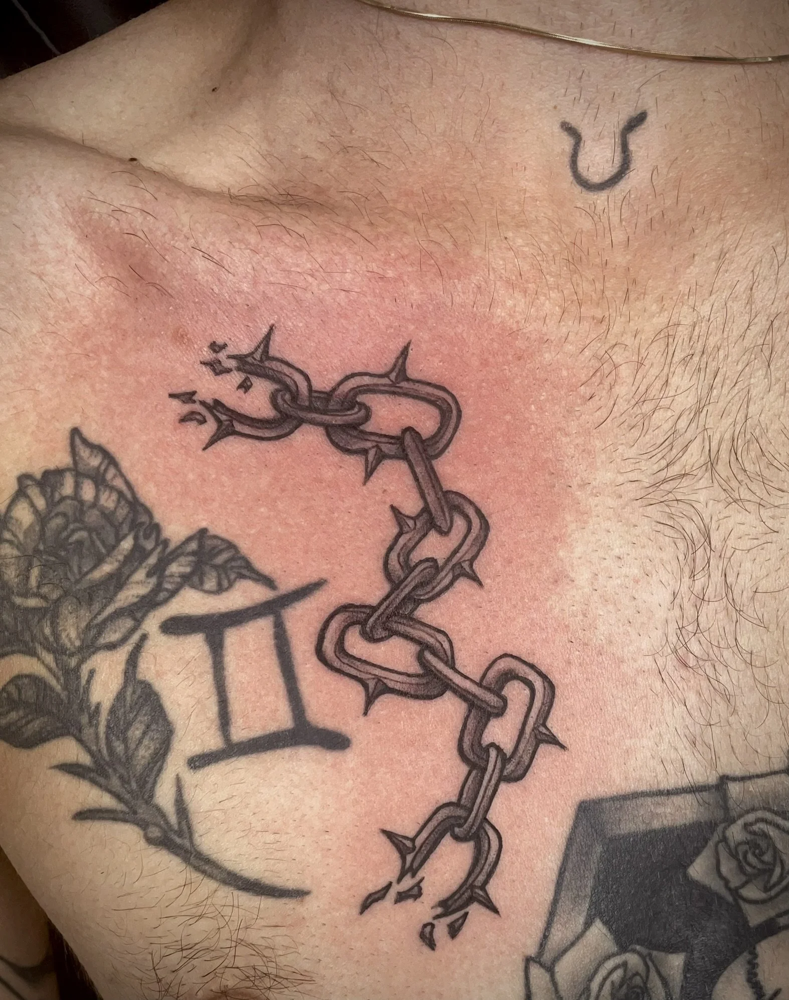 traditional chain tattoo, black and gray, tattooed by Zing Phelps, in Cedar Rapids, Iowa