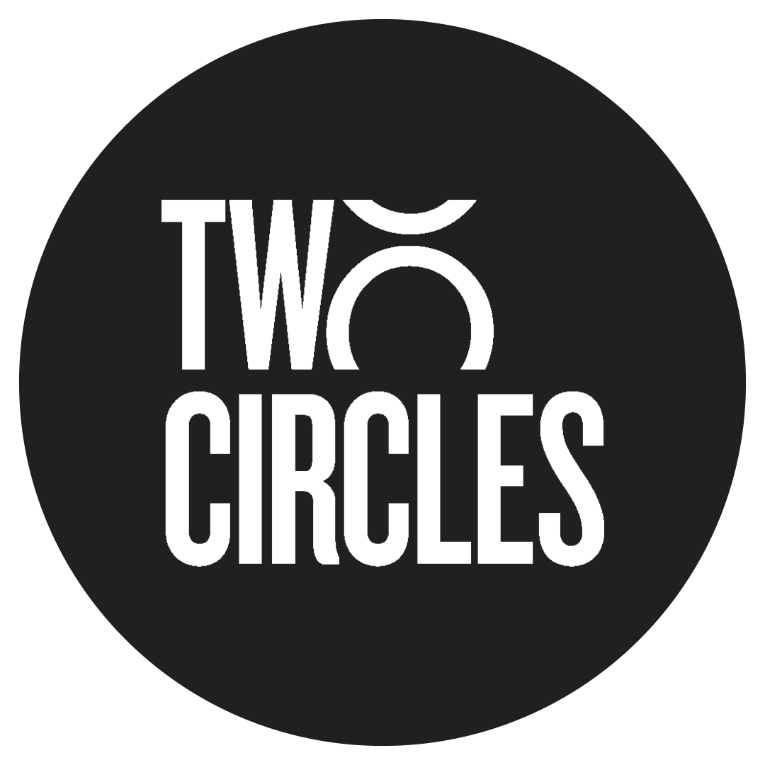 Black circular logo with white text that reads "TWO CIRCLES" with a stylized letter 'O'.