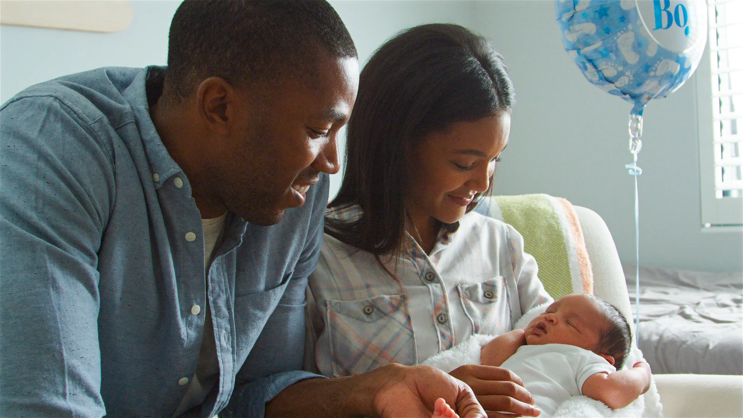 Loving parents with new baby boy