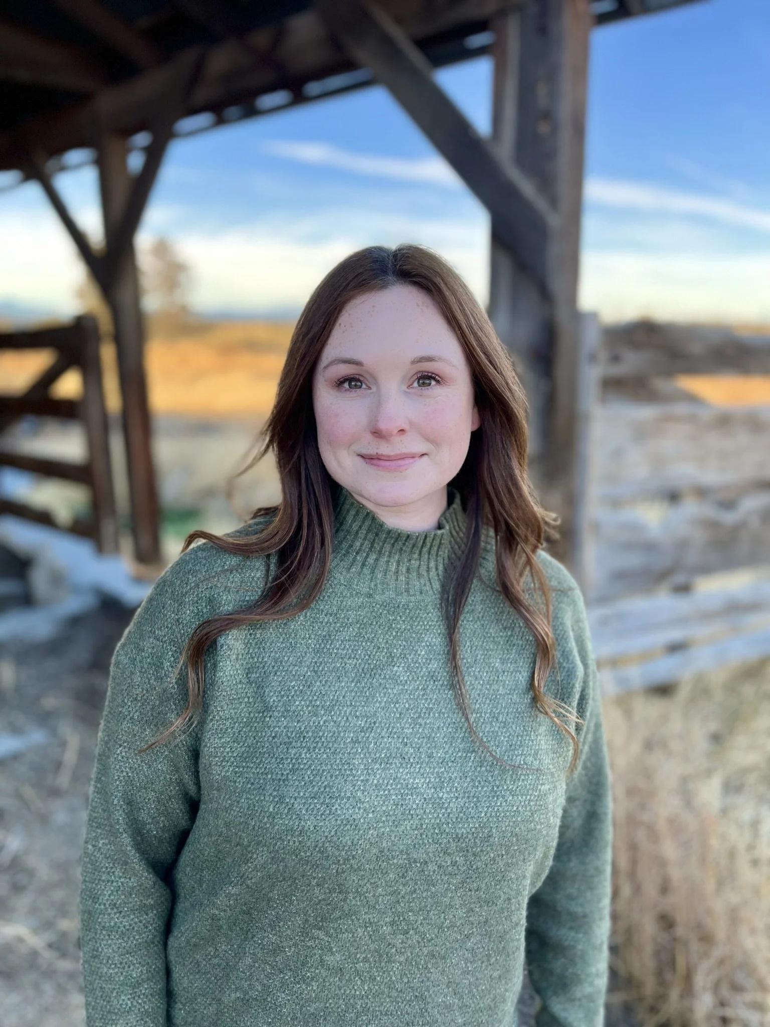 Jessica, founder of Everywhere Learning, outdoors in a green sweater