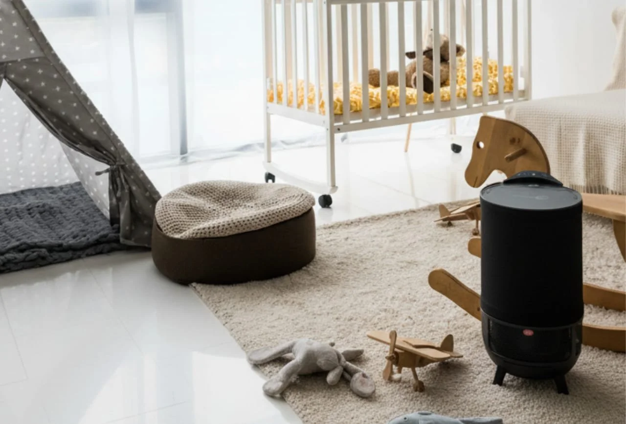 Child's playroom with tent, pet bed, toys, rocking horse, airplane toy, and air purifier on plush rug