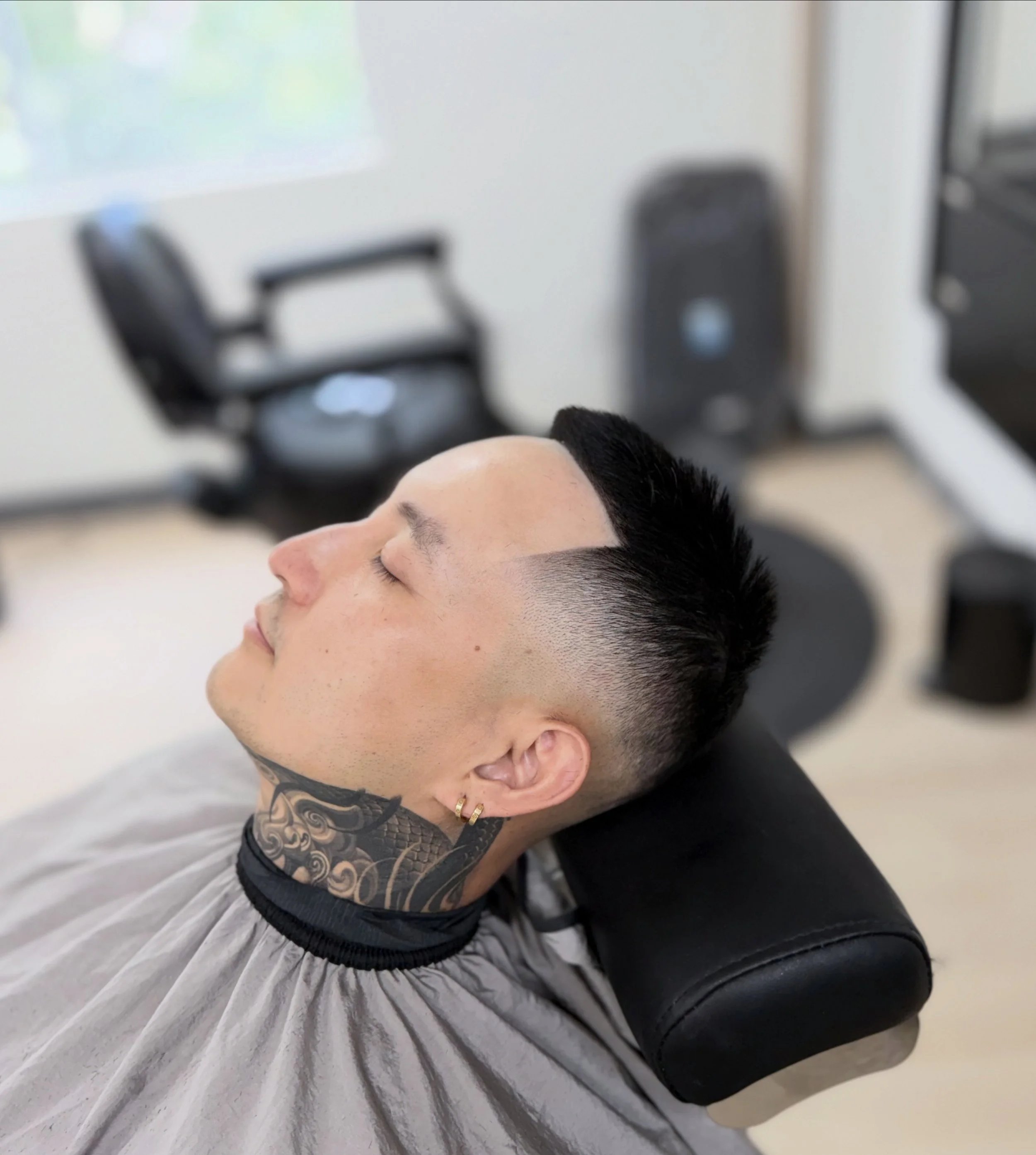 Mid skin fade finishing with a line-up.