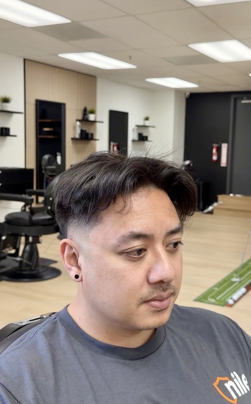 Burst fade with curtain bangs trimmed