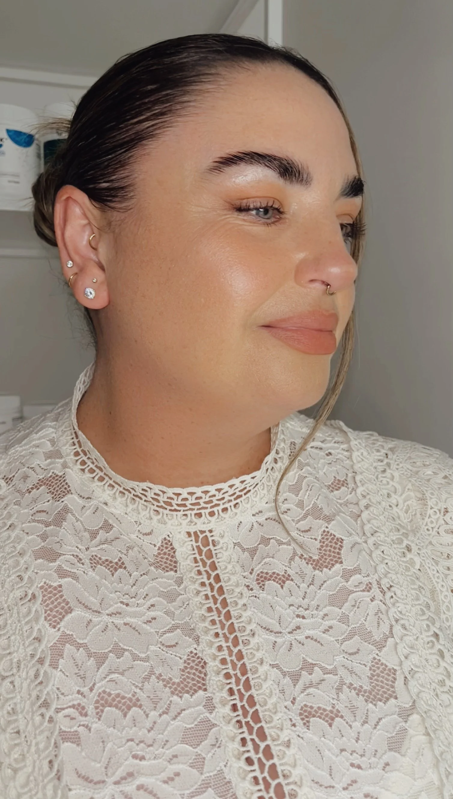 Melissa White, Clinical Naturopath and owner of wite your health clinic, wearing a white lace top and smiling.