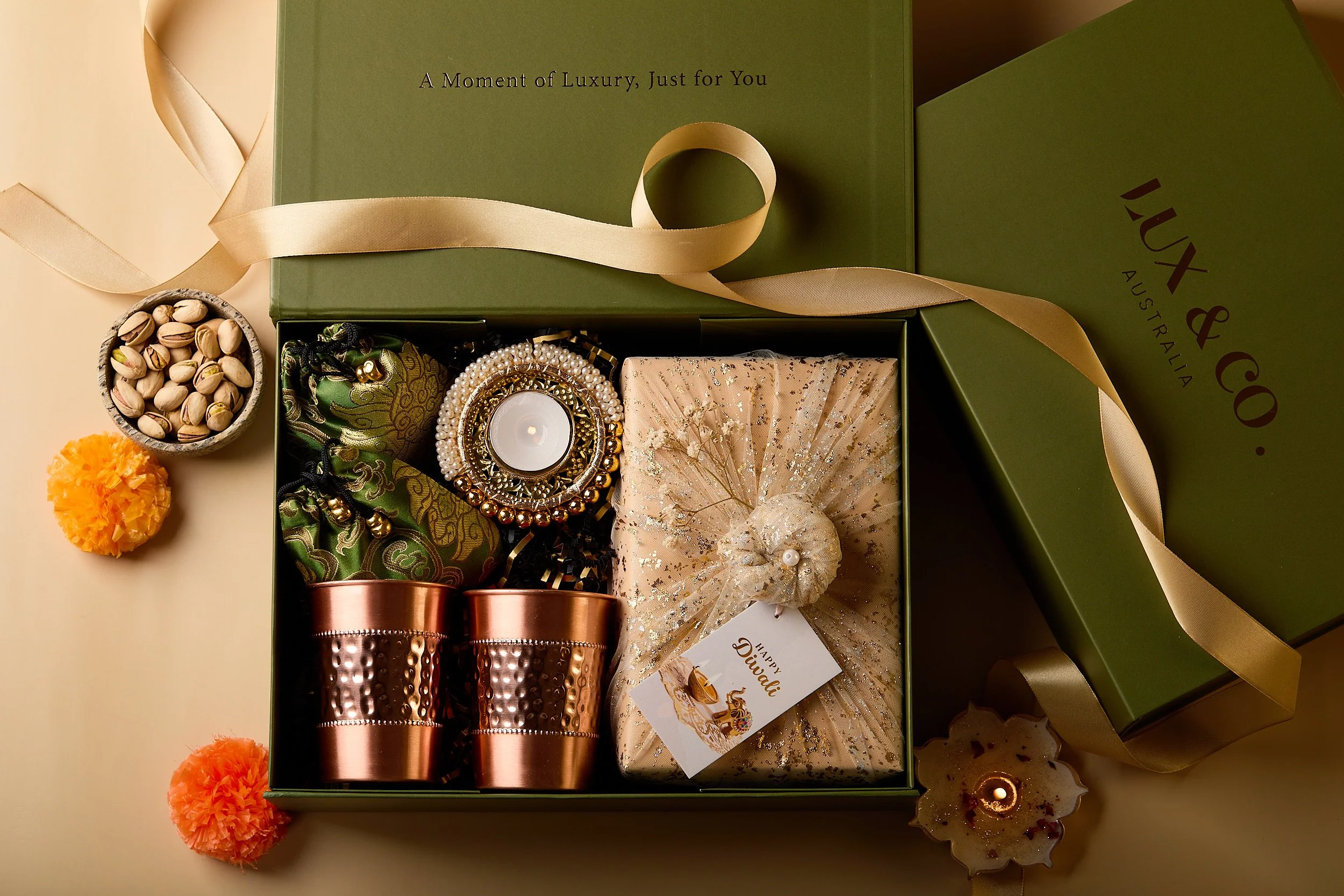 Lux & Co. Australia scented candles and festive gift set photographed with green packaging and natural styling — Sydney product photographer Mah Vafaei.