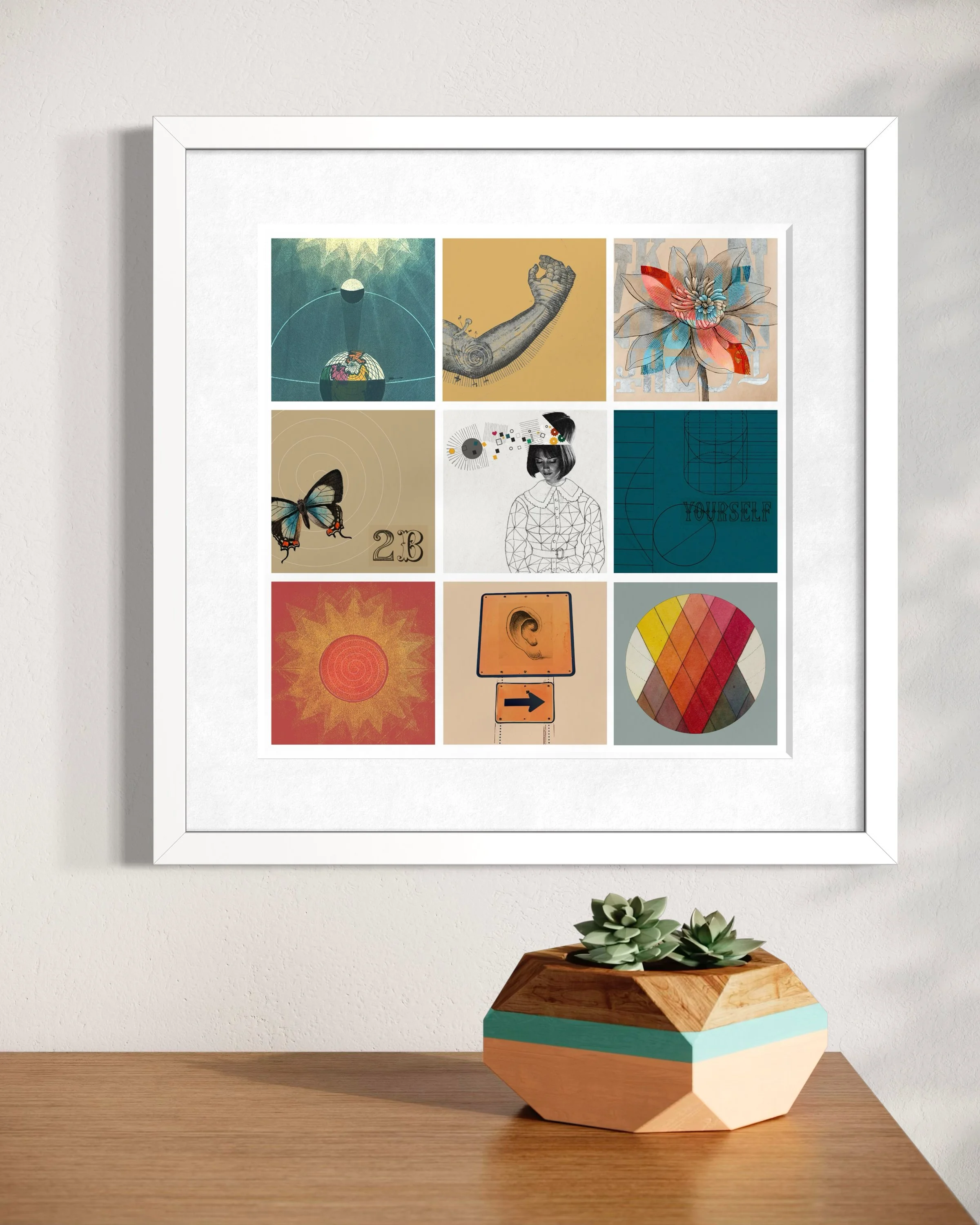 Fragments collage print in a white frame hanging on a light wall above a geometric wooden planter with succulents, styled in a bright modern interior.