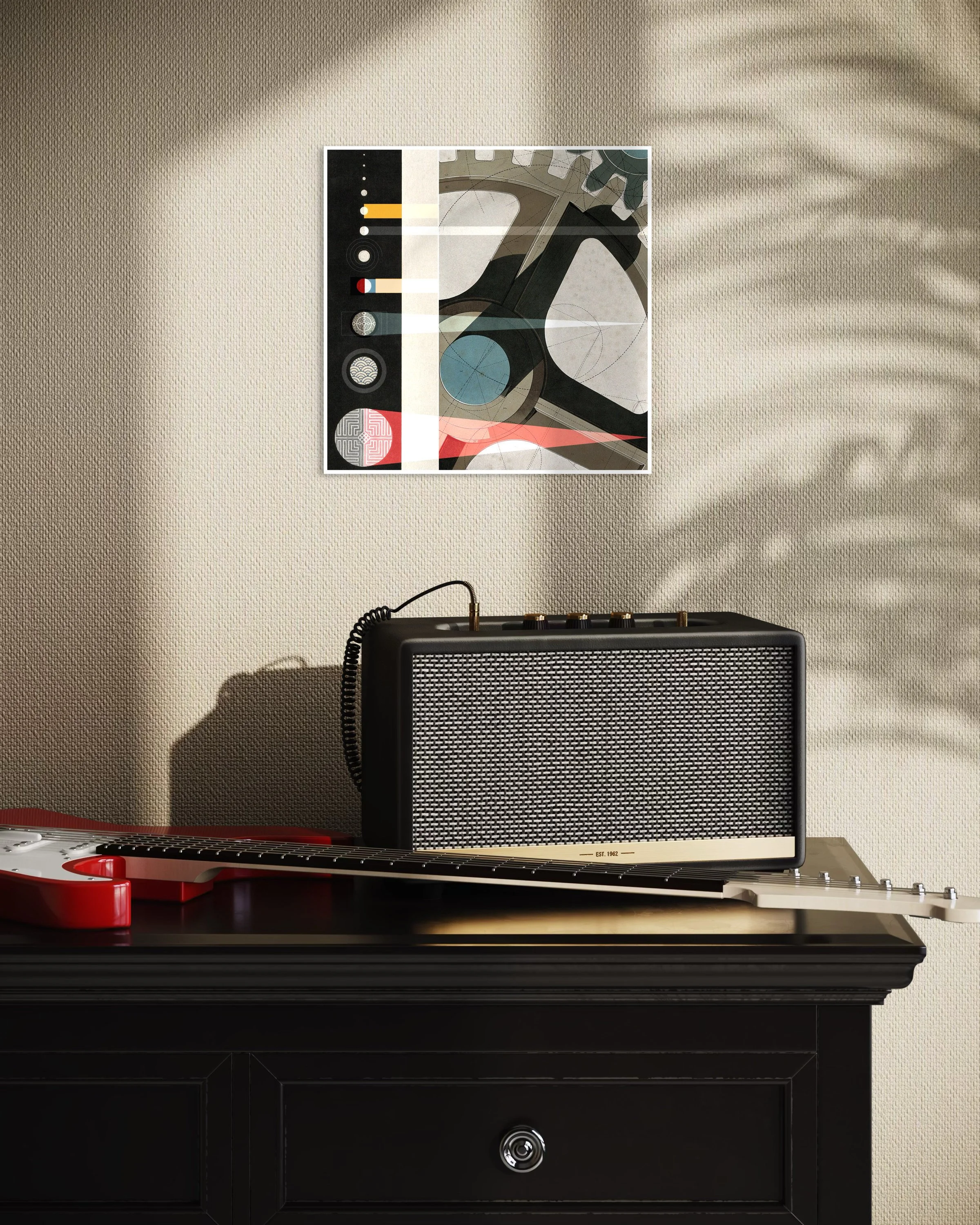 The Planets fine-art print displayed on a beige wall above a guitar amplifier and electric guitar, with strong afternoon light casting plant shadows across the scene