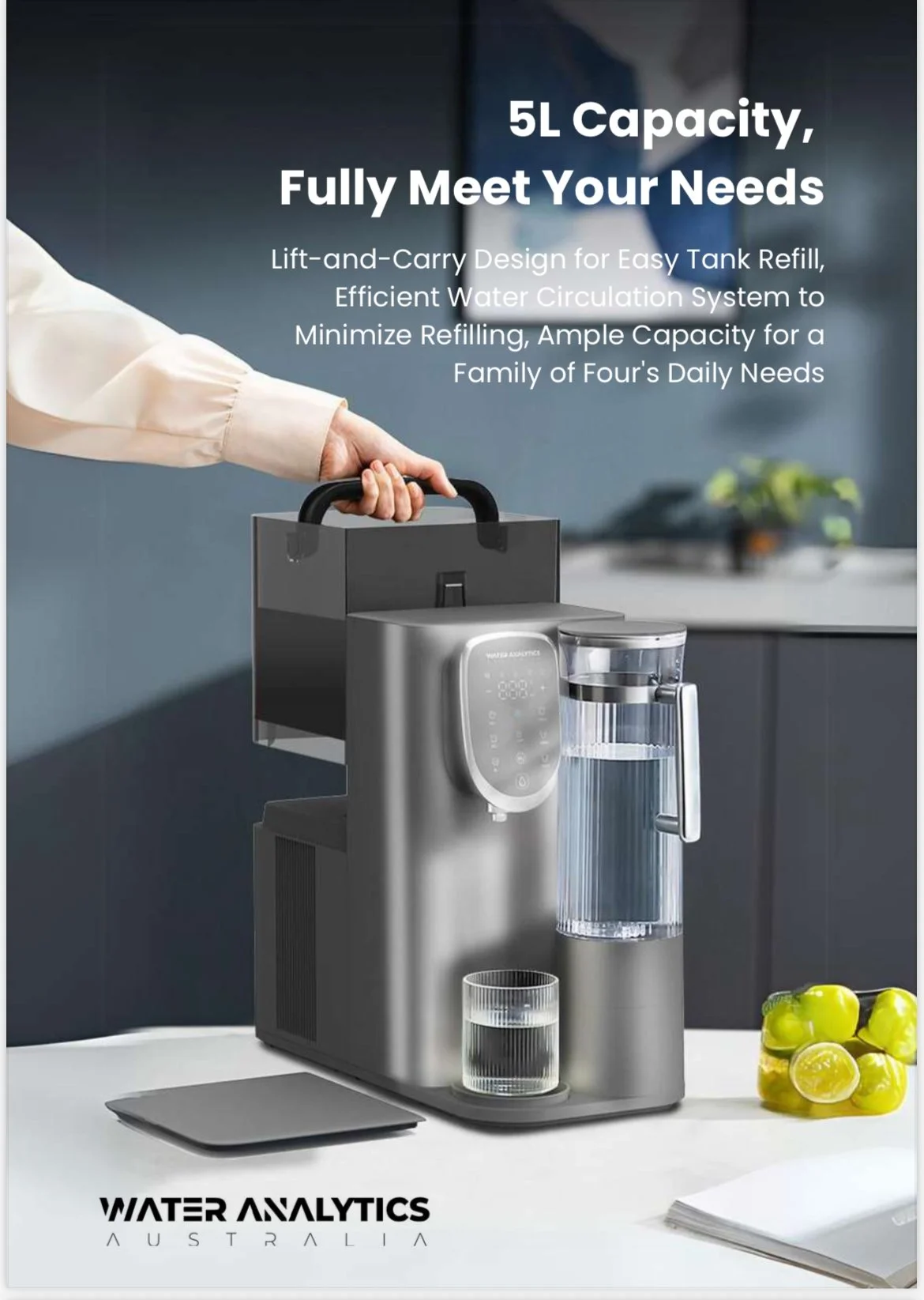 A water purifier with a digital display, a water measurement container, and a black handle on top, placed on a white surface with lemons and a notebook nearby.