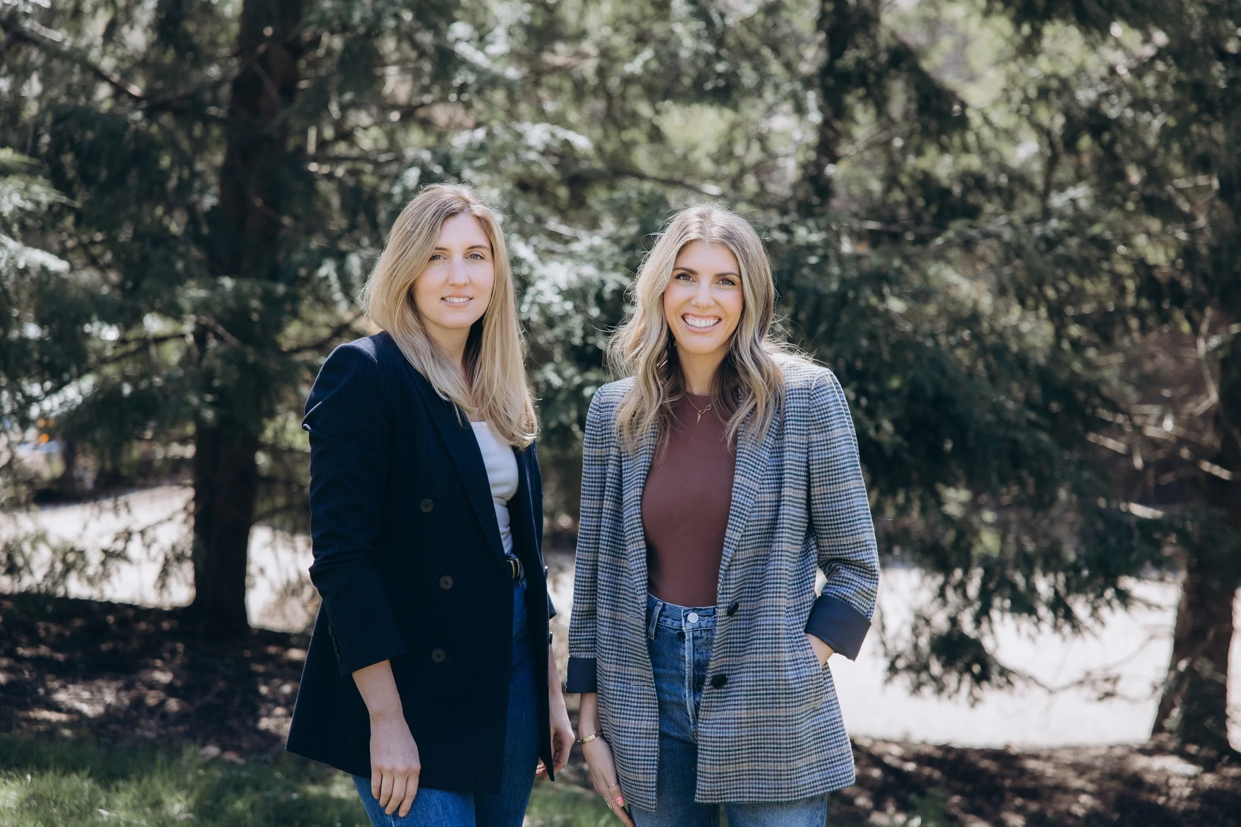Julia and Jessica of Wolff Duran Studio standing outdoors.