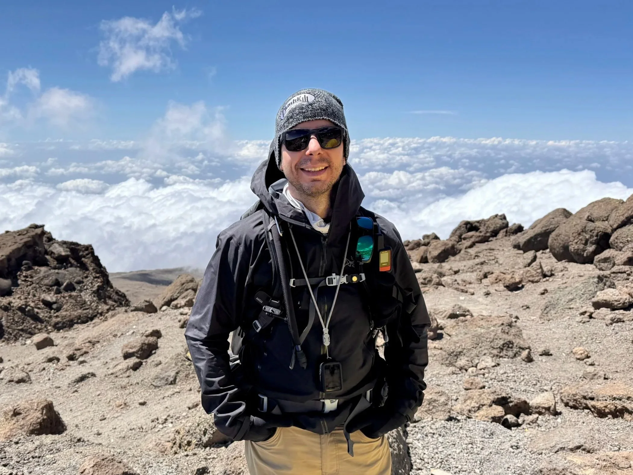Mike McAleer, founder of Persuasion Edge, on Mount Kilimanjaro, representing sales training, body language, and behavioral science expertise.