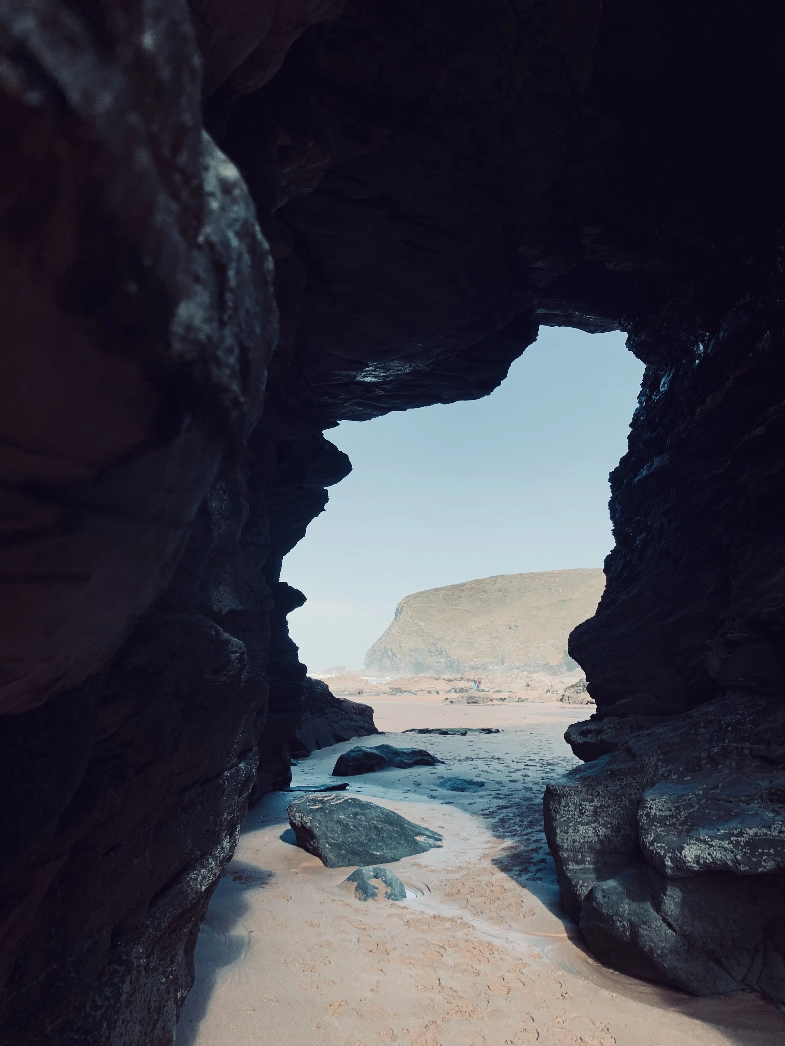 Mindful tarot discovery session symbolised by a cave opening onto the sea, representing clarity, reflection, and new perspective