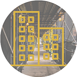Construction site with yellow and gray metal structures and scaffolding