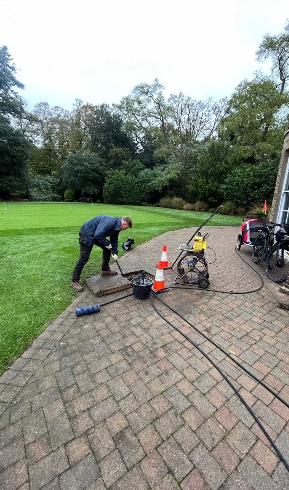 Drainage Technician at LC Drainage inspecting a drainage system using a CCTV drainage equipment to produce a drainage report.
