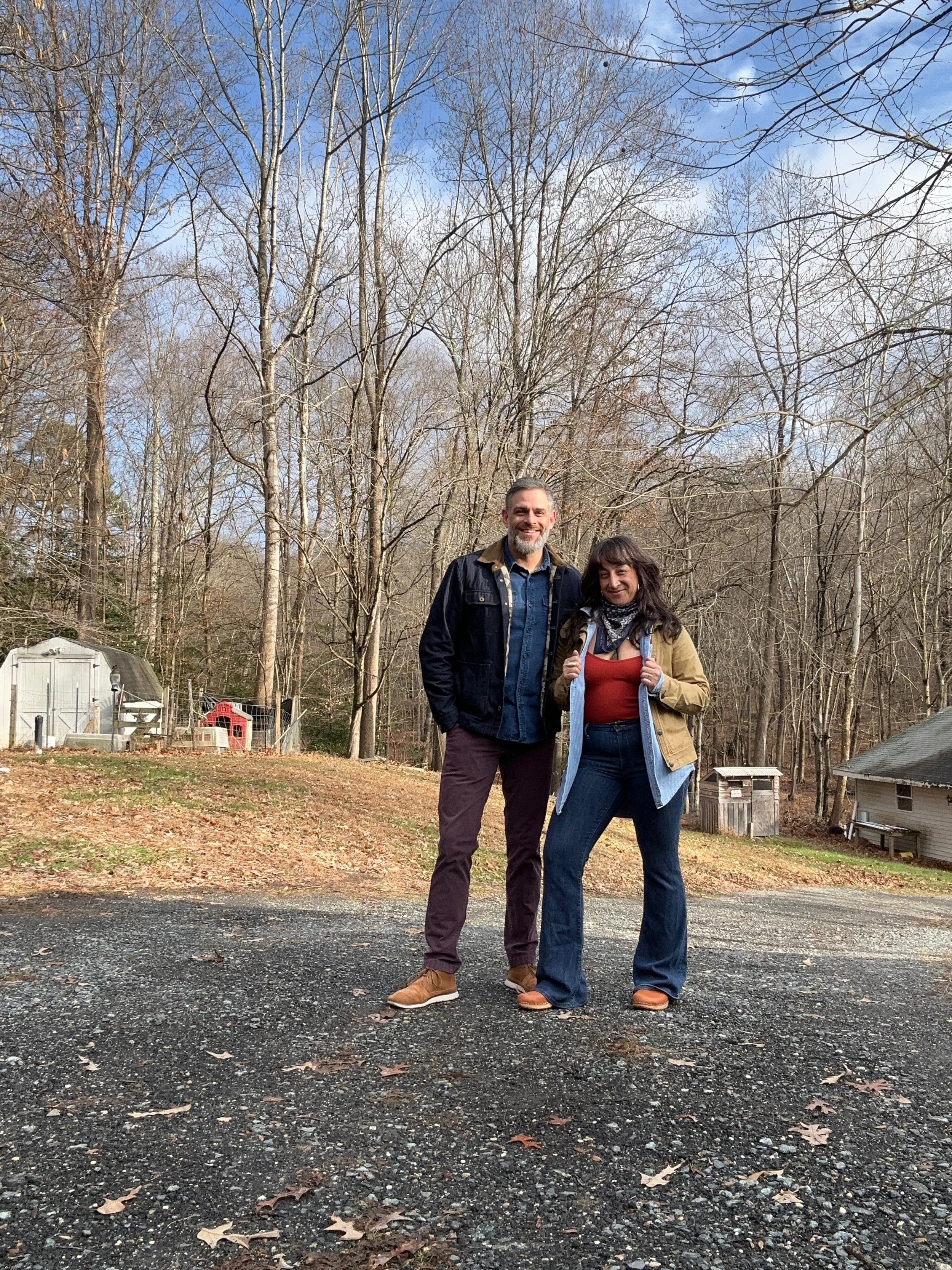 John and Eryka standing side by side dressed in denim and workwear