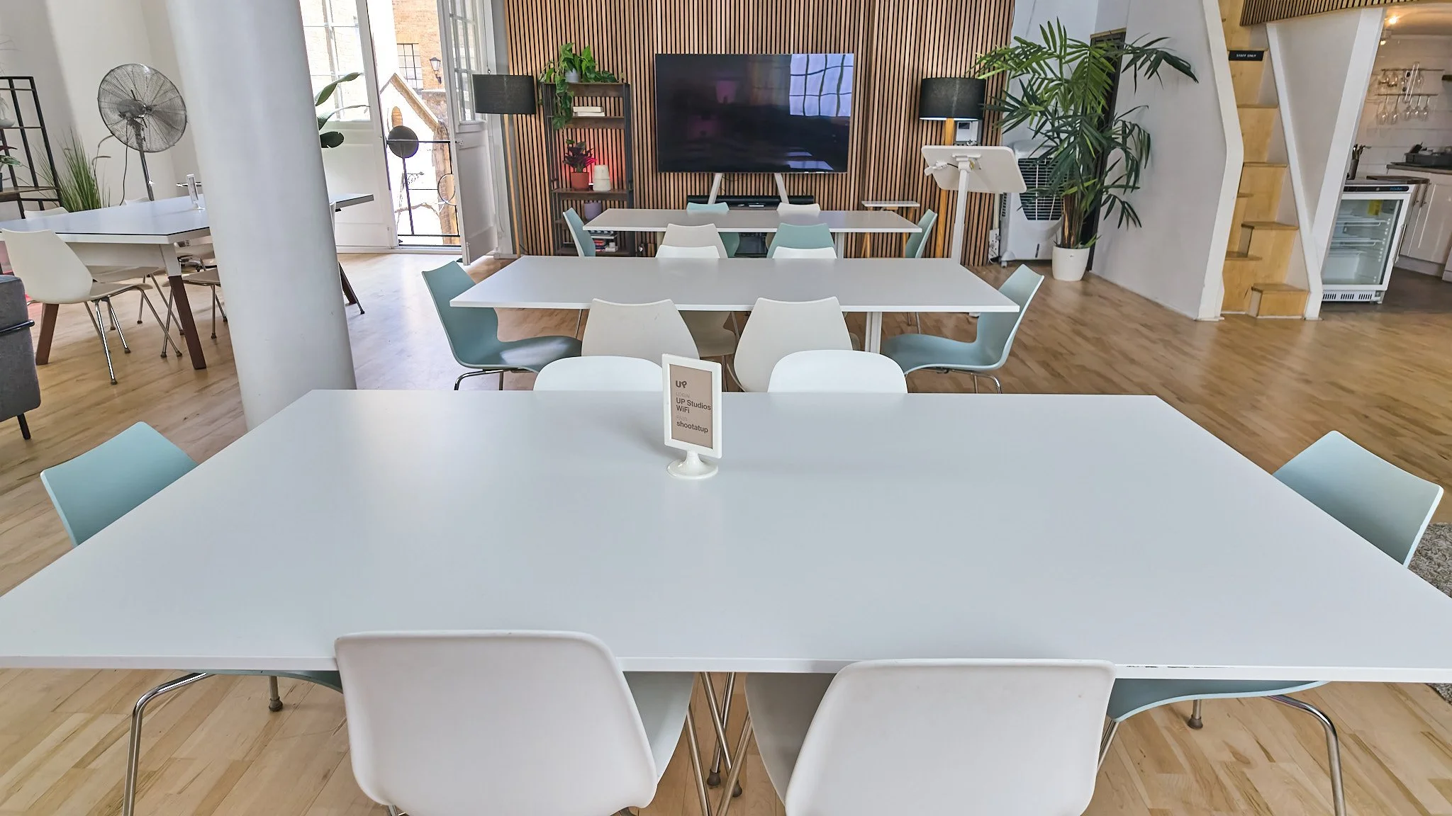 Wide-angle event space – The full room in workshop layout, showing scale and natural light throughout.