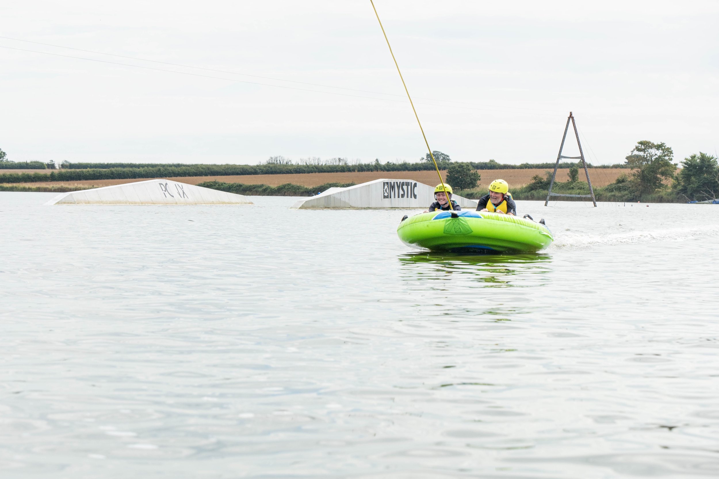 Family enjoying the Ringo rides at Curve Water Sports Essex