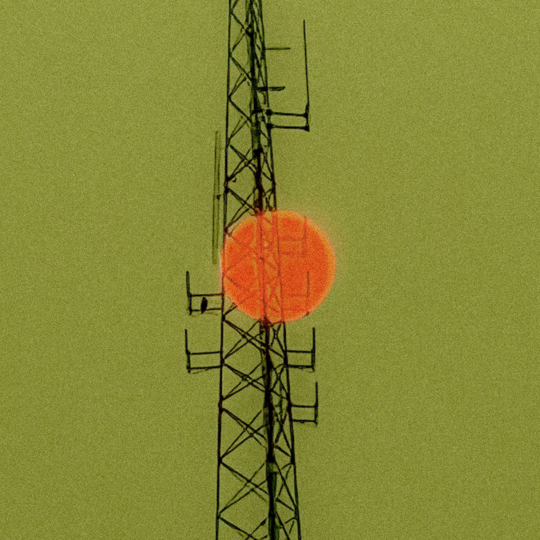 A metal transmission tower with antennas, standing against a greenish sky with a red sun or moon behind it.