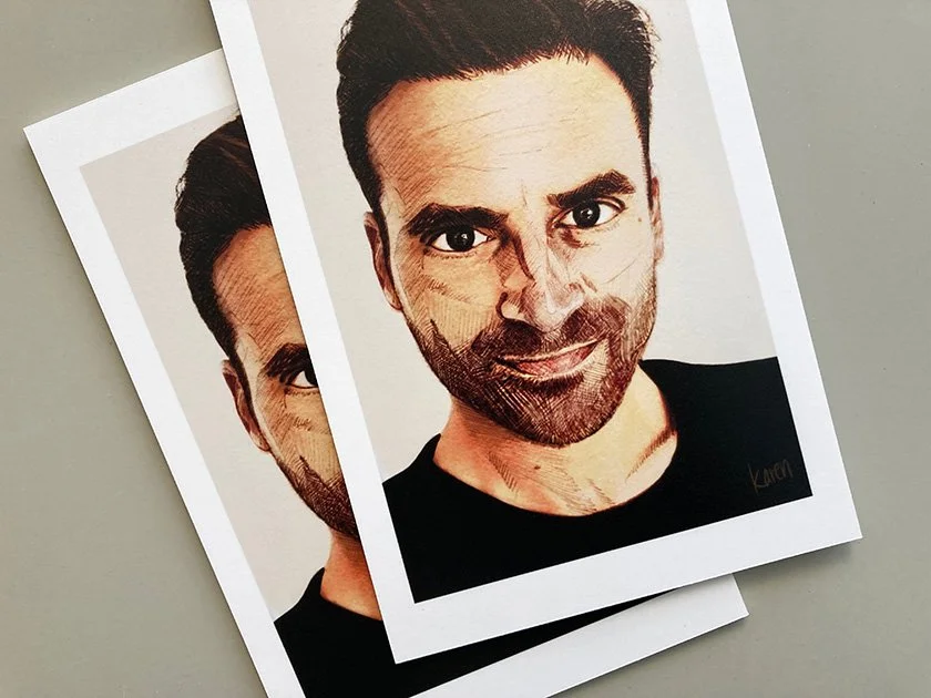 Two printed photos of a man with dark hair, beard, and a black shirt, arranged overlapping on a gray surface; the photos have a stylized, artistic filter.