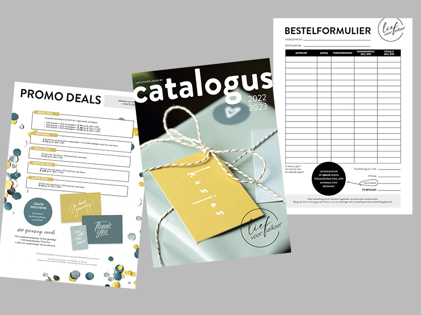 Collection of printed catalogs, order forms, and promotional booklet on gray background.