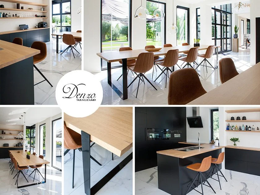 Modern kitchen and dining area with large windows, wooden dining table, and tan chairs, decorated with minimalistic shelves and plants.