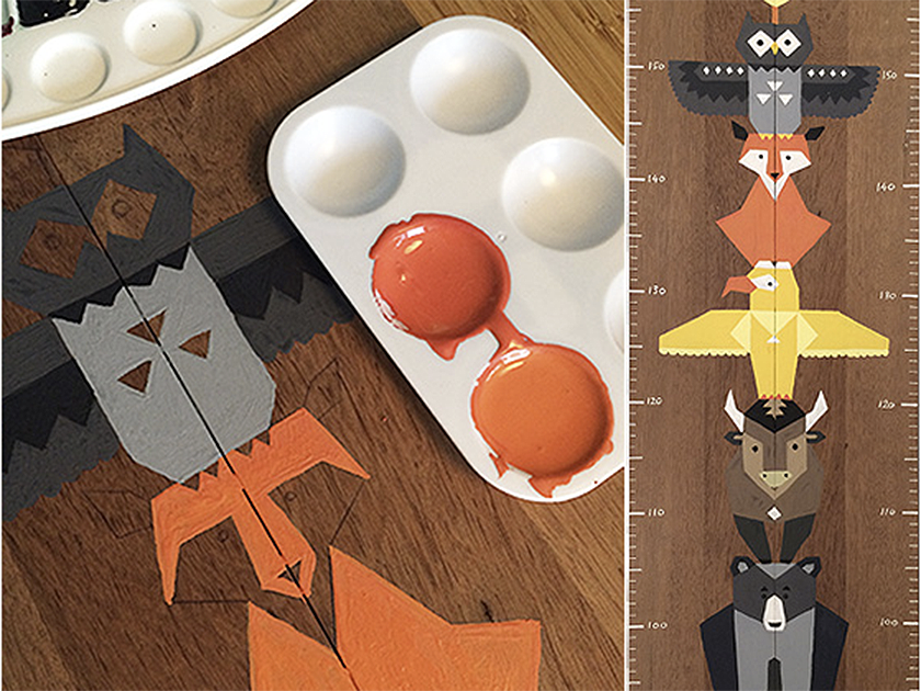 Wooden table with colorful origami animal figures, watercolor paints, and a paint palette.