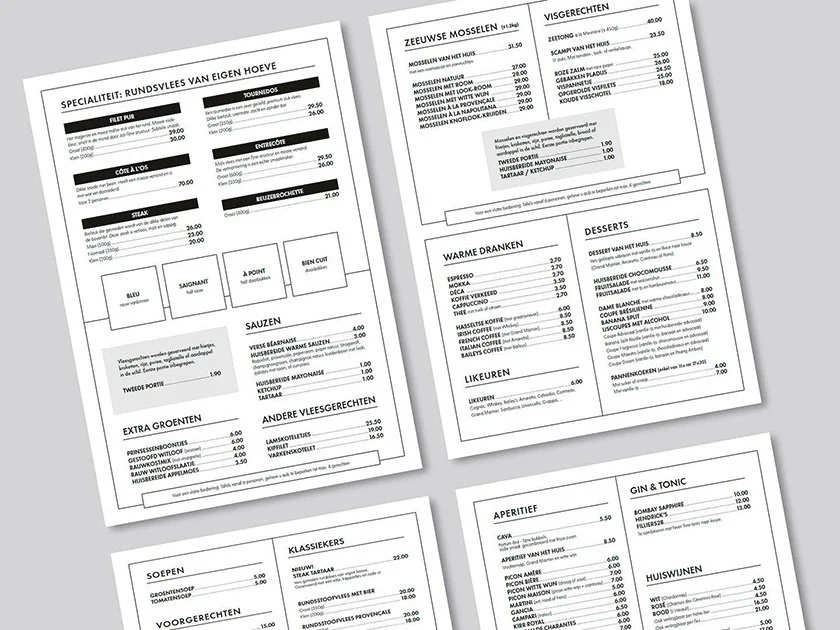 Four menus in a restaurant, displayed on a table, showing dishes and prices including seafood, drinks, desserts, and specialities, in Dutch and English.