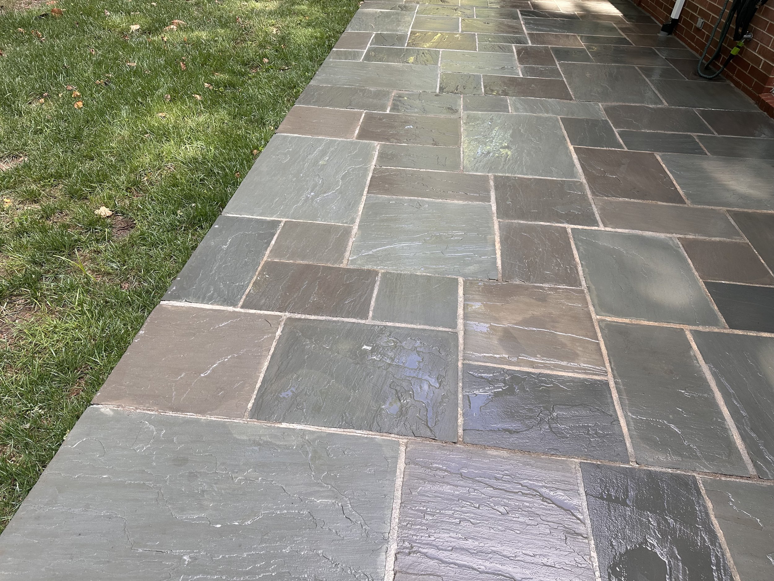 Freshly cleaned natural bluestone patio