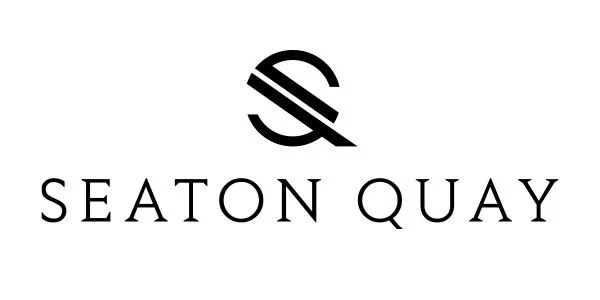 Seaton Quay logo with stylized S over diagonal lines and the words 'Seaton Quay' underneath.