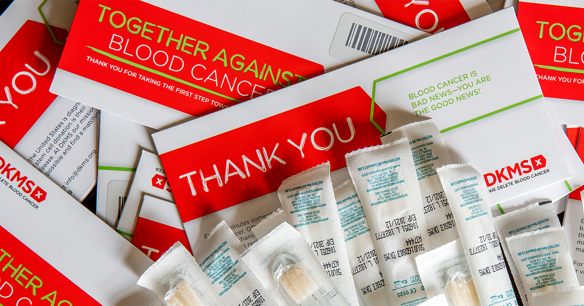 Cards, medication packets, and informational flyers related to blood cancer awareness and donation awareness from DKMS, a blood cancer foundation.