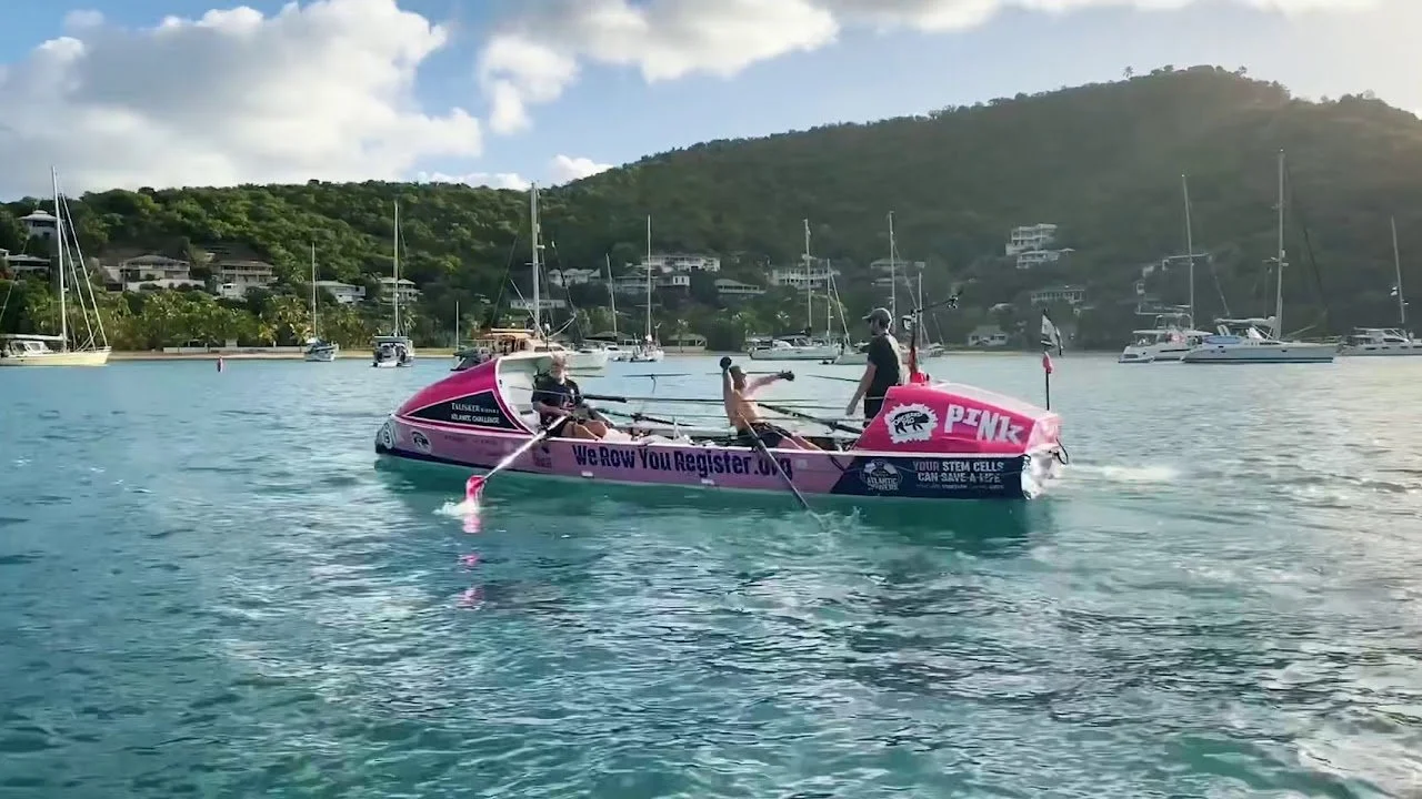 Team Margot finishing the World's Toughest Row. 'We Now You Register' on the side.