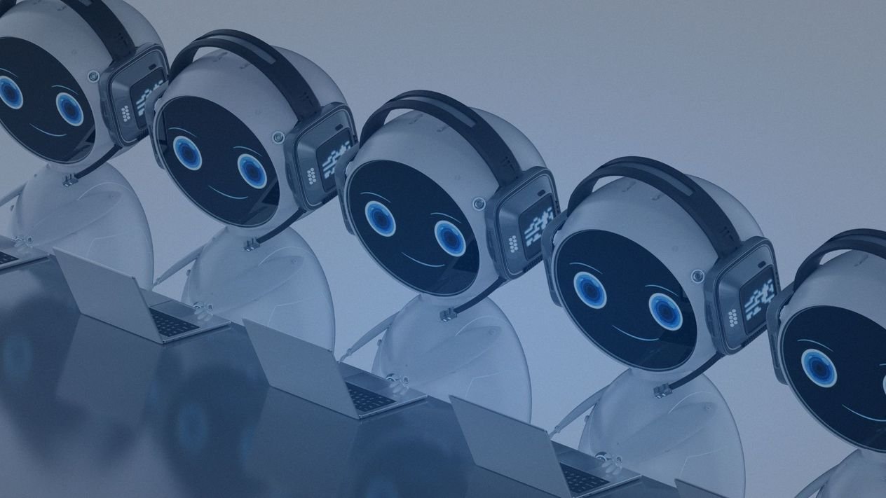 Group of robots with smiling face displays, each wearing headphones and working on laptops.