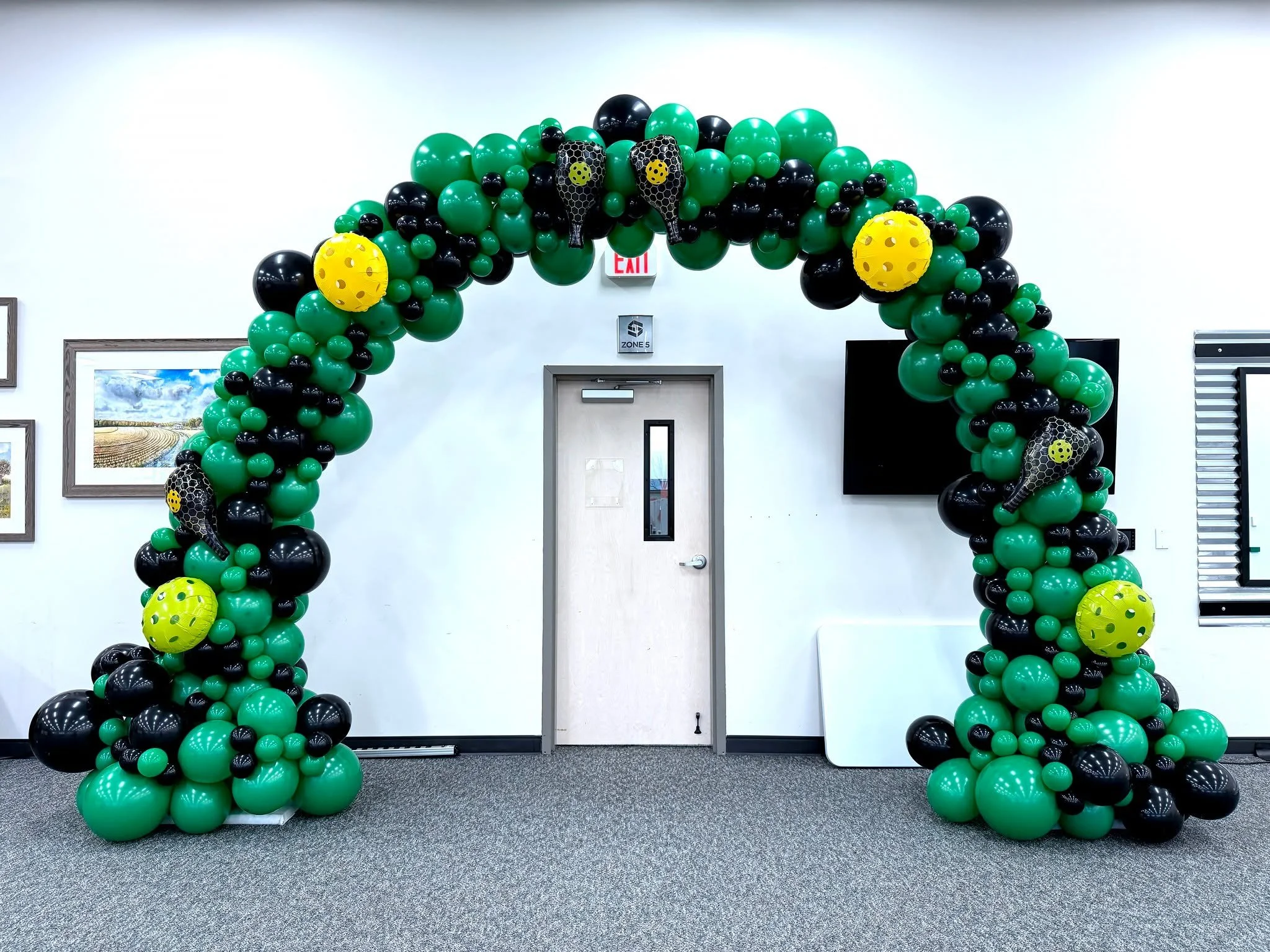 Pickleball-themed Zebra Lunch Event at ScanSource brought to life with fun and vibrant d&eacute;cor! 🏓🎉 The space was decorated with our 5' marquee letters, a festive balloon arch, balloon columns, and floating helium balloons, creating an energeti