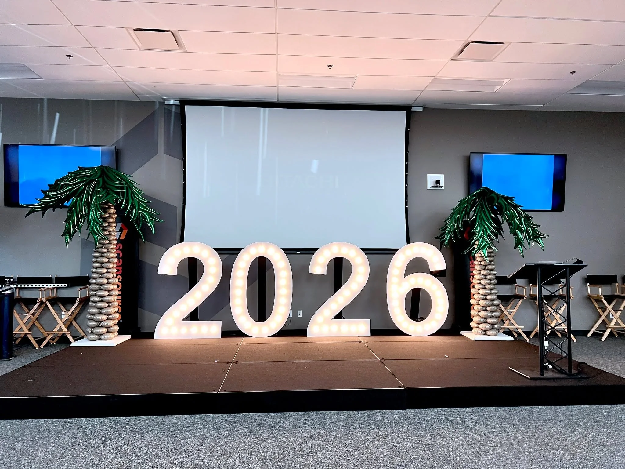 A standout look for a Global Company Meeting at ScanSource 🌍✨ Our d&eacute;cor included 5' tall marquee numbers displaying 2026, a money balloon arch, and palm tree balloon columns, blending corporate style with a creative, modern twist. 🎈🌴

Krist