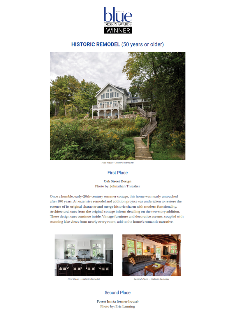 A large white house with multiple levels, balconies, and a steep, gabled roof, situated on a hillside surrounded by trees and a wooden staircase leading up to it.